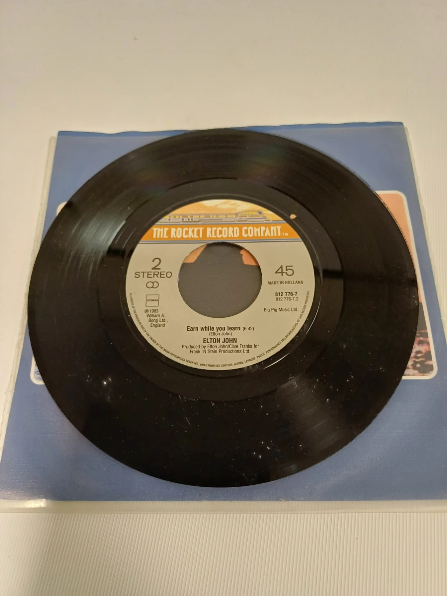 2 singles Elton John