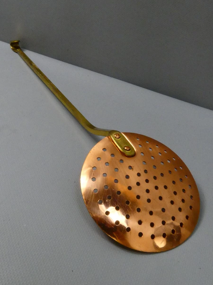 Vintage koperen schuimspaan met messing geklonken handvat