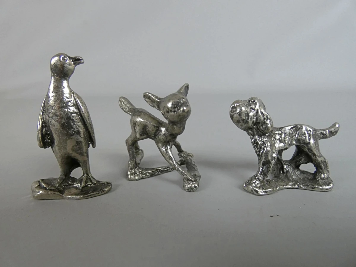 Set van drie metalen dierenfiguren