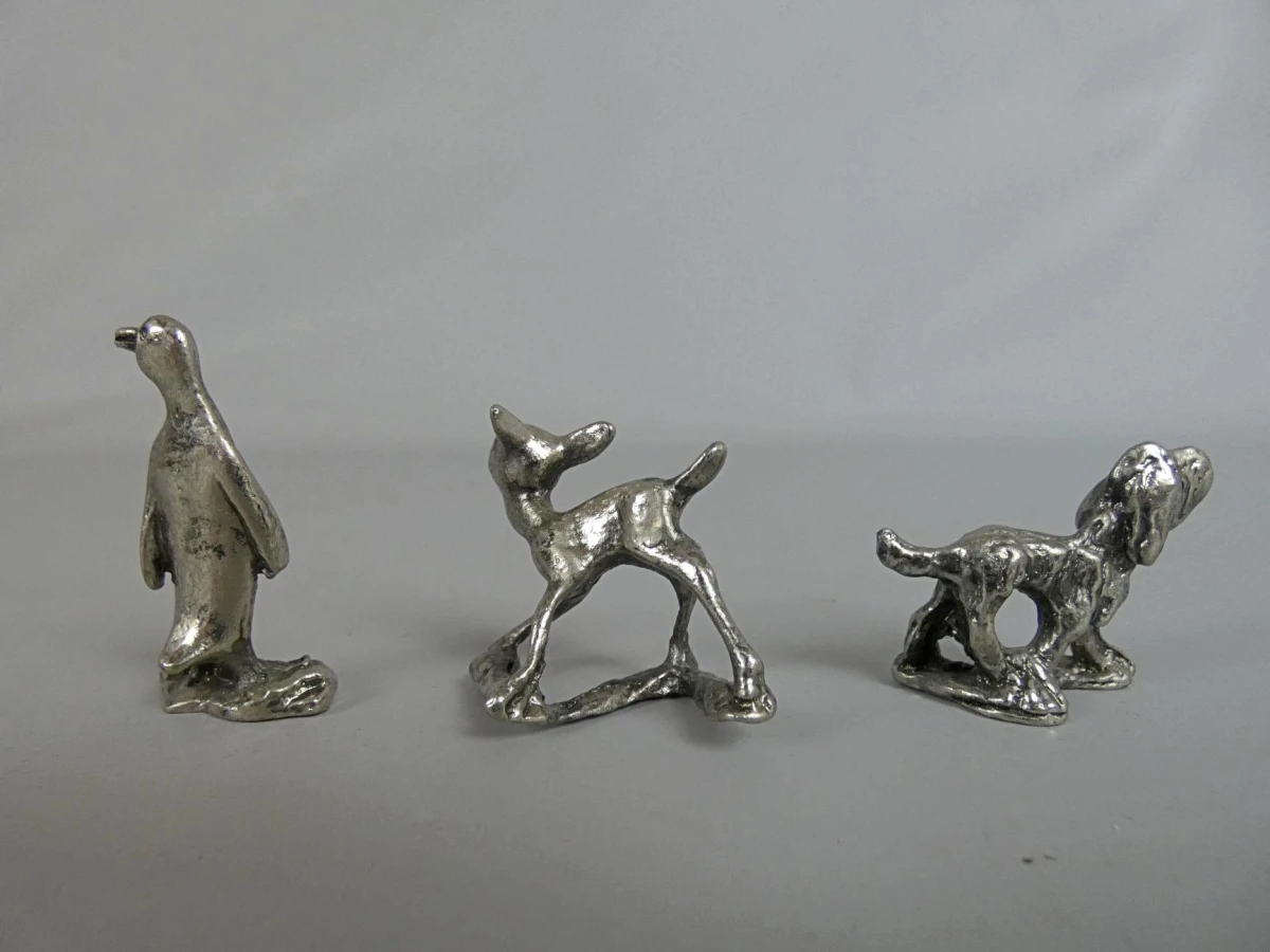 Set van drie metalen dierenfiguren