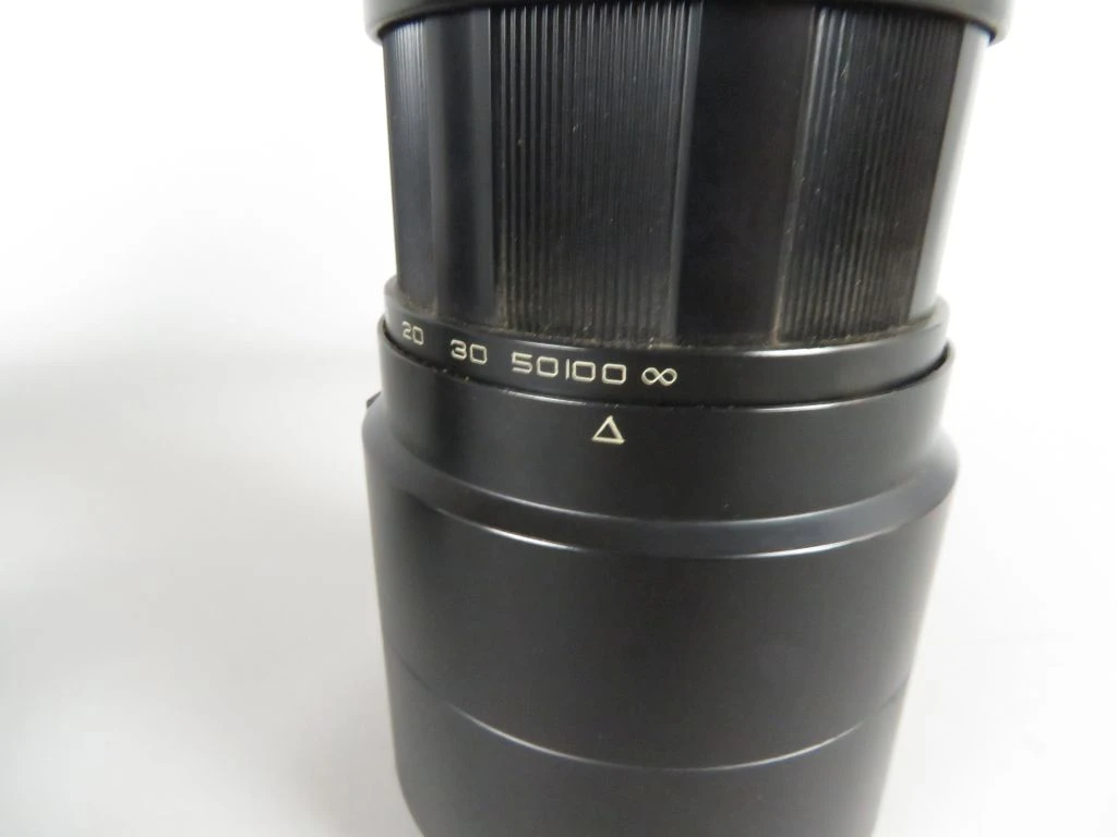 Vintage camera lens met filters en draagtas