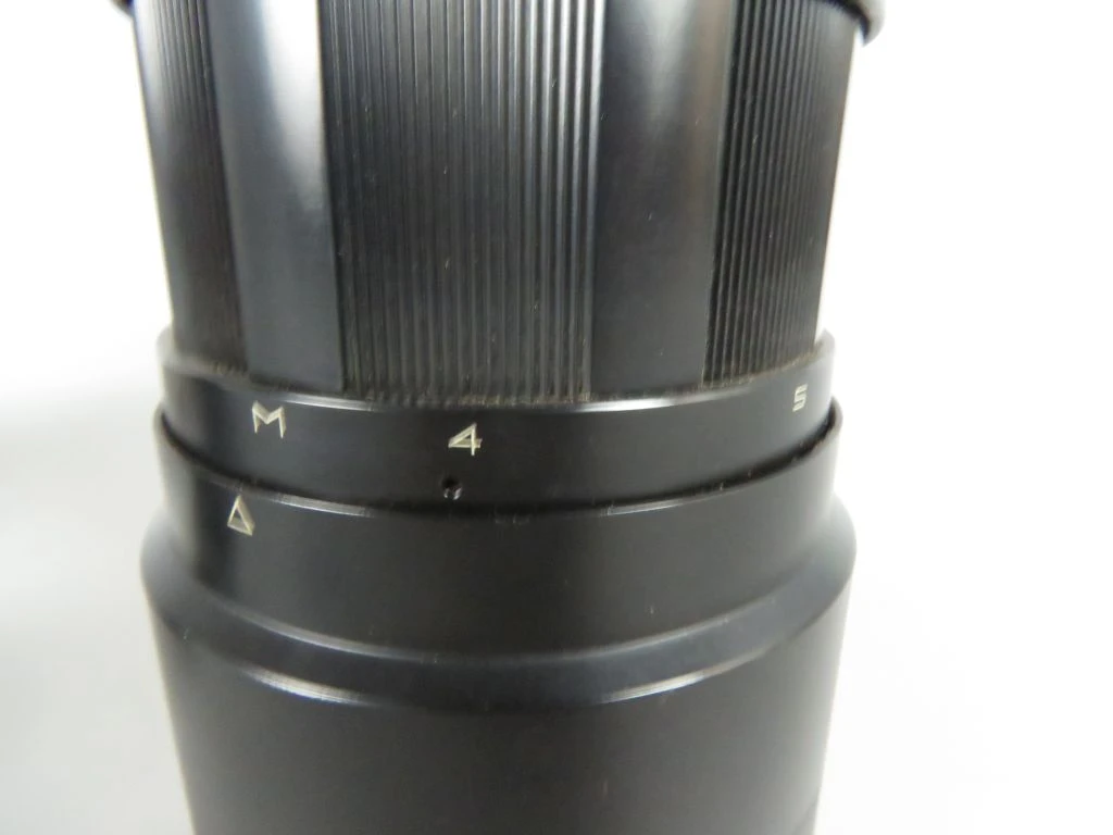 Vintage camera lens met filters en draagtas