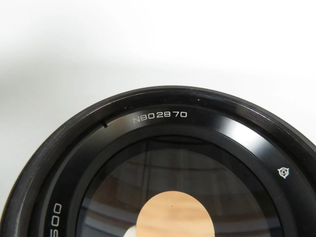 Vintage camera lens met filters en draagtas