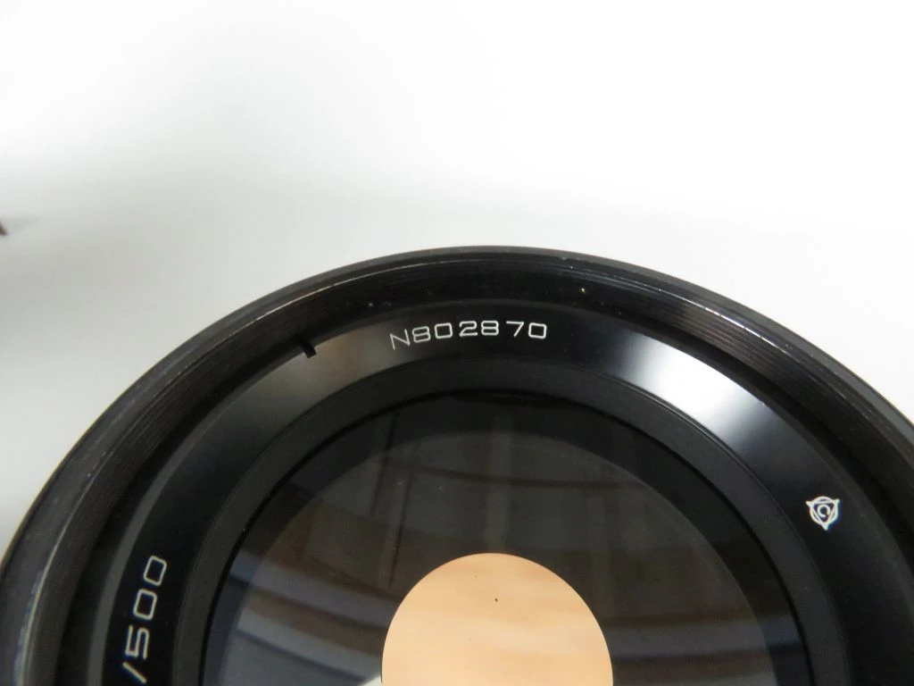 Vintage camera lens met filters en draagtas