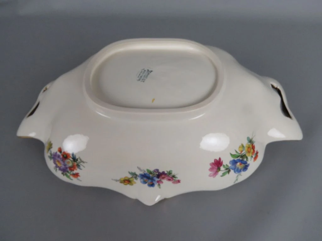 Decoratief porseleinen dienblad met bloemenmotief en gouden rand
