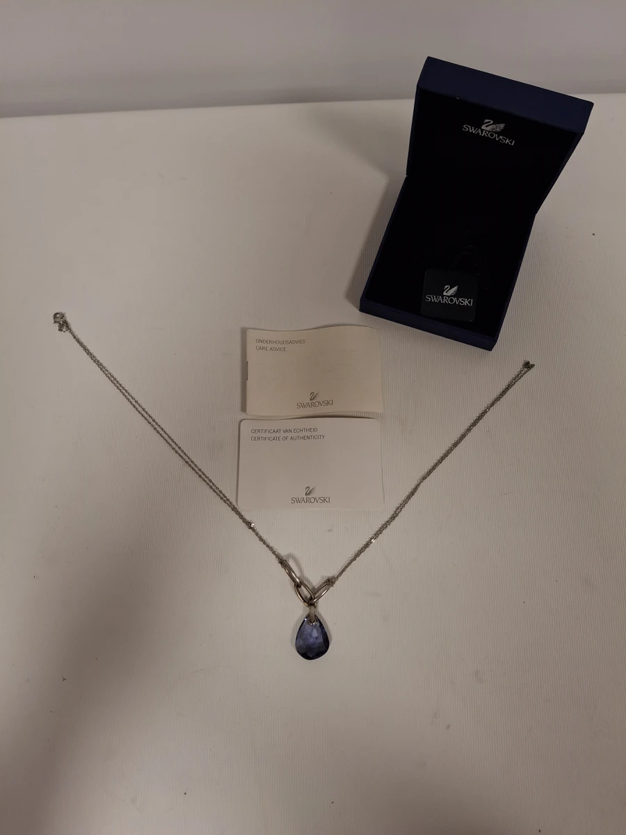 Swarovski ketting met blauwe steen en certificaat