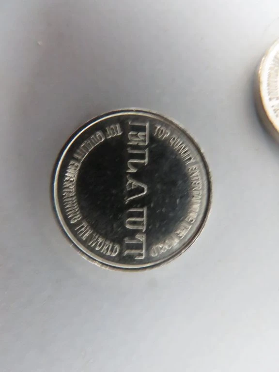 Set van metalen munten met opdruk 'ELAUT'