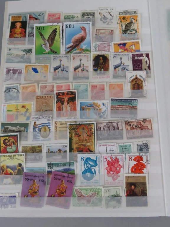 Postzegelverzameling in album met Belgische en vele andere postzegels