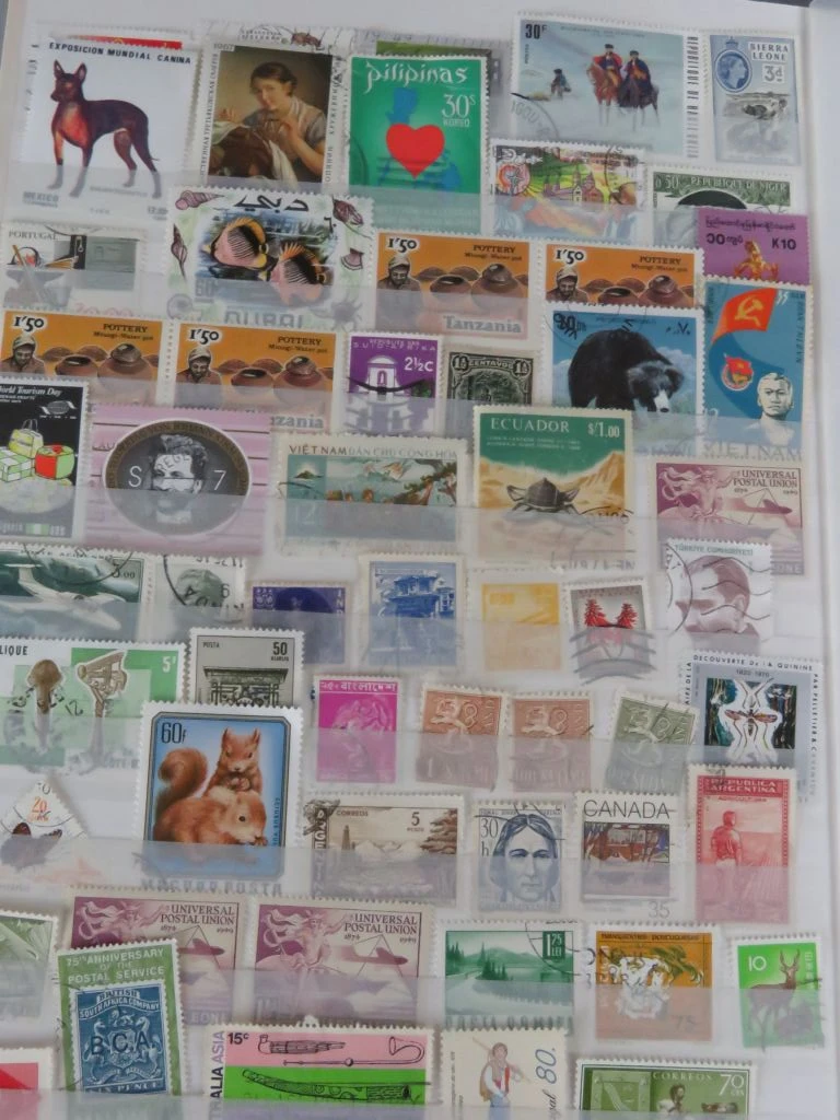 Postzegelverzameling in album met Belgische en vele andere postzegels