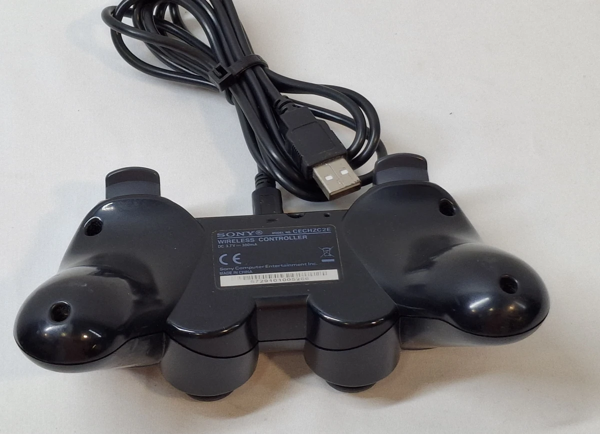 PlayStation 3 console met controller en 2 spellen - foto 10