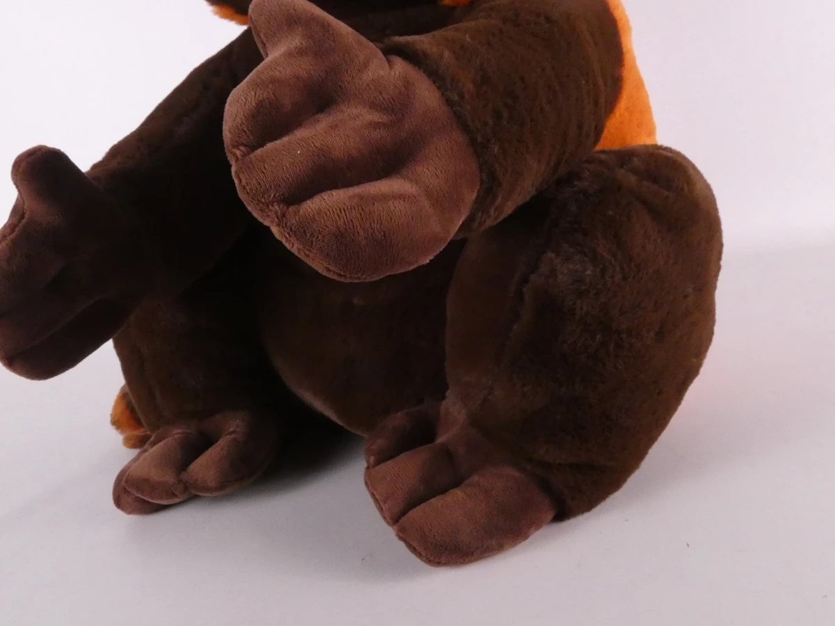 Grote bruine en cognackleurige wasbeer-knuffel