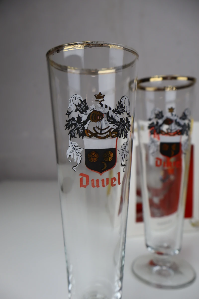 Lot van 11 Duvel bierglazen met verschillende prints - foto 4