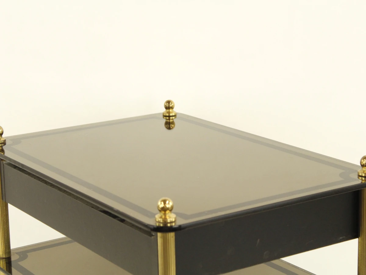 Zwart glazen salontafel met lade en messing poten