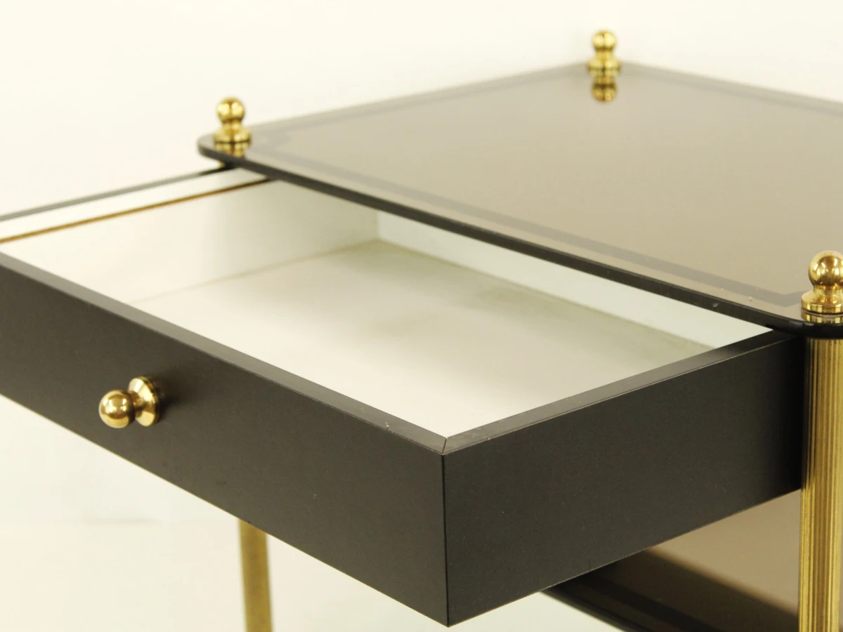 Zwart glazen salontafel met lade en messing poten