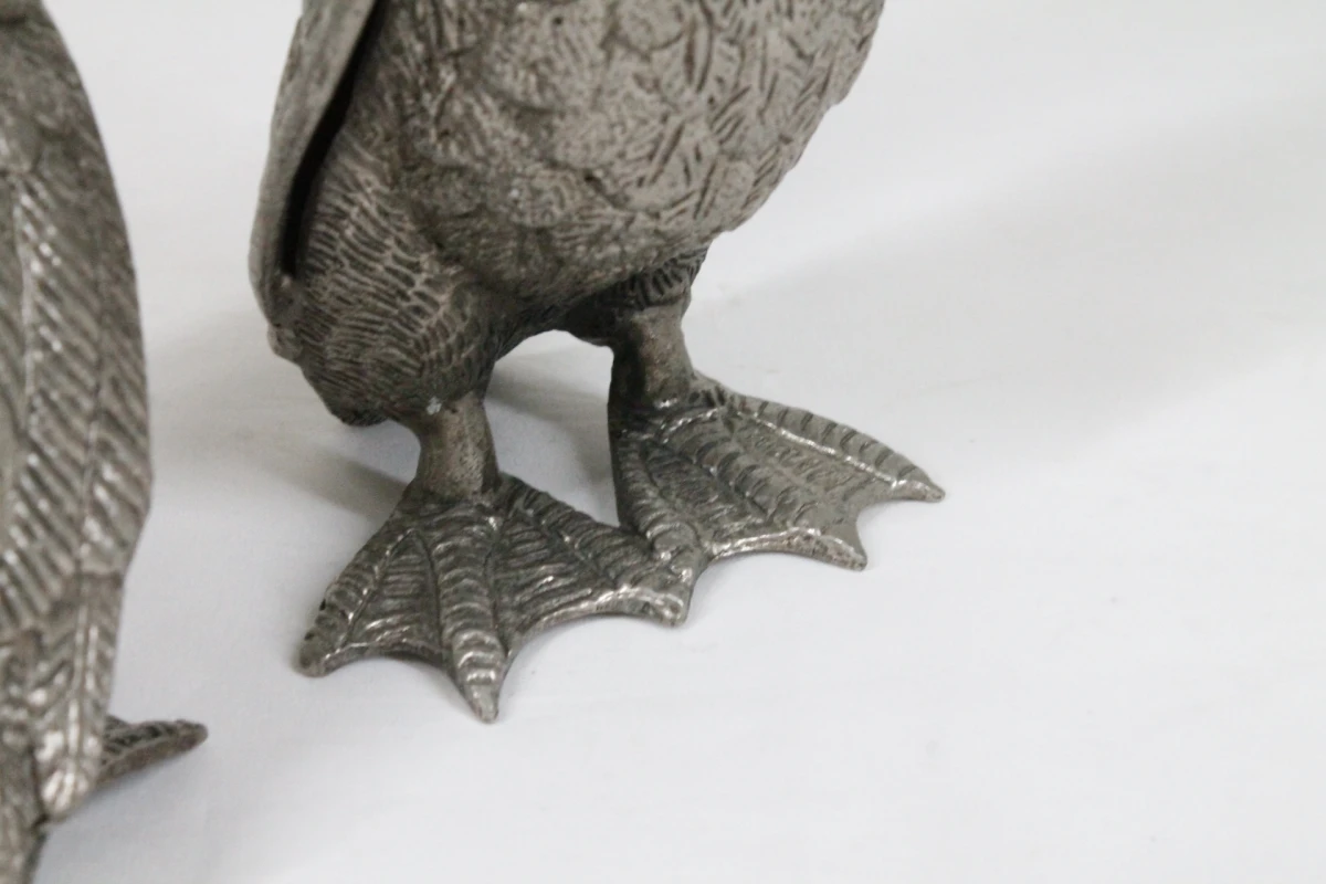 Set van 2 metalen eenden beeldjes