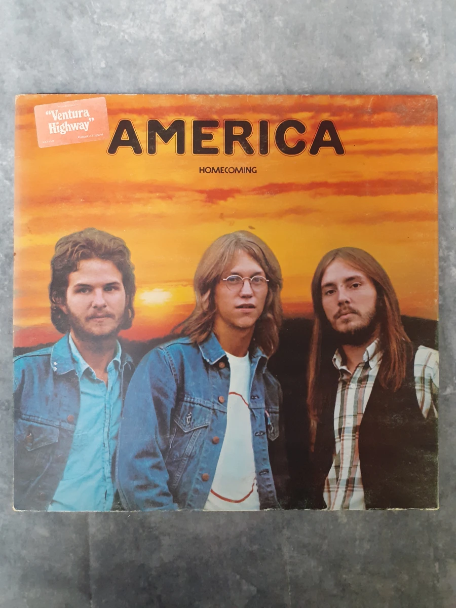 Vinyl: America - Homecoming – kavel bij De Kringwinkel, Gent