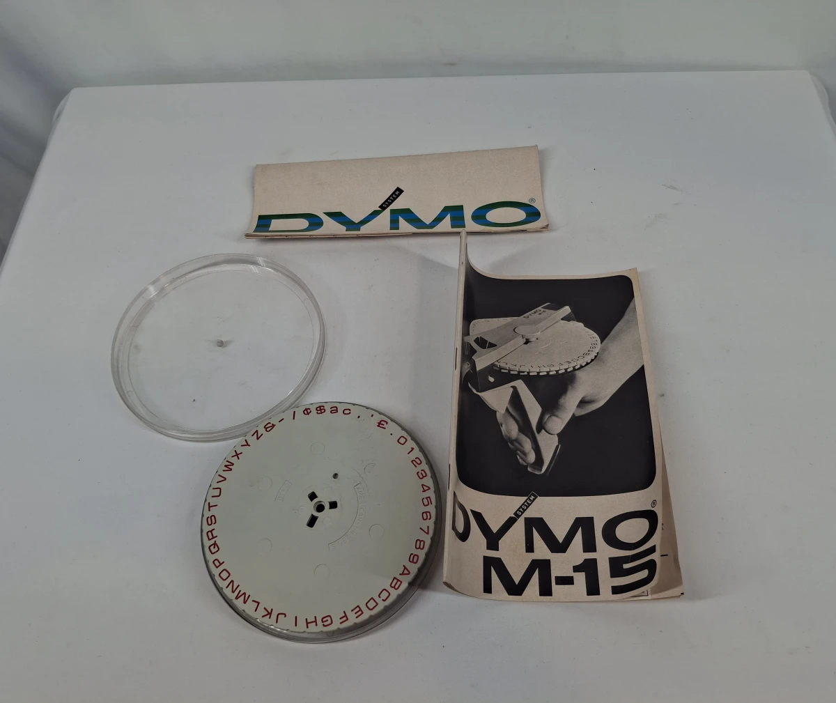 Vintage Dymo M-15 labelmaker met cassette en handleiding - foto 2