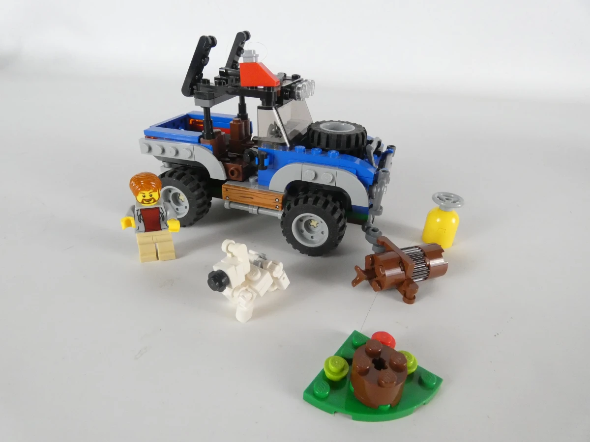 Diverse LEGO bouwsets met voertuigen en handleidingen