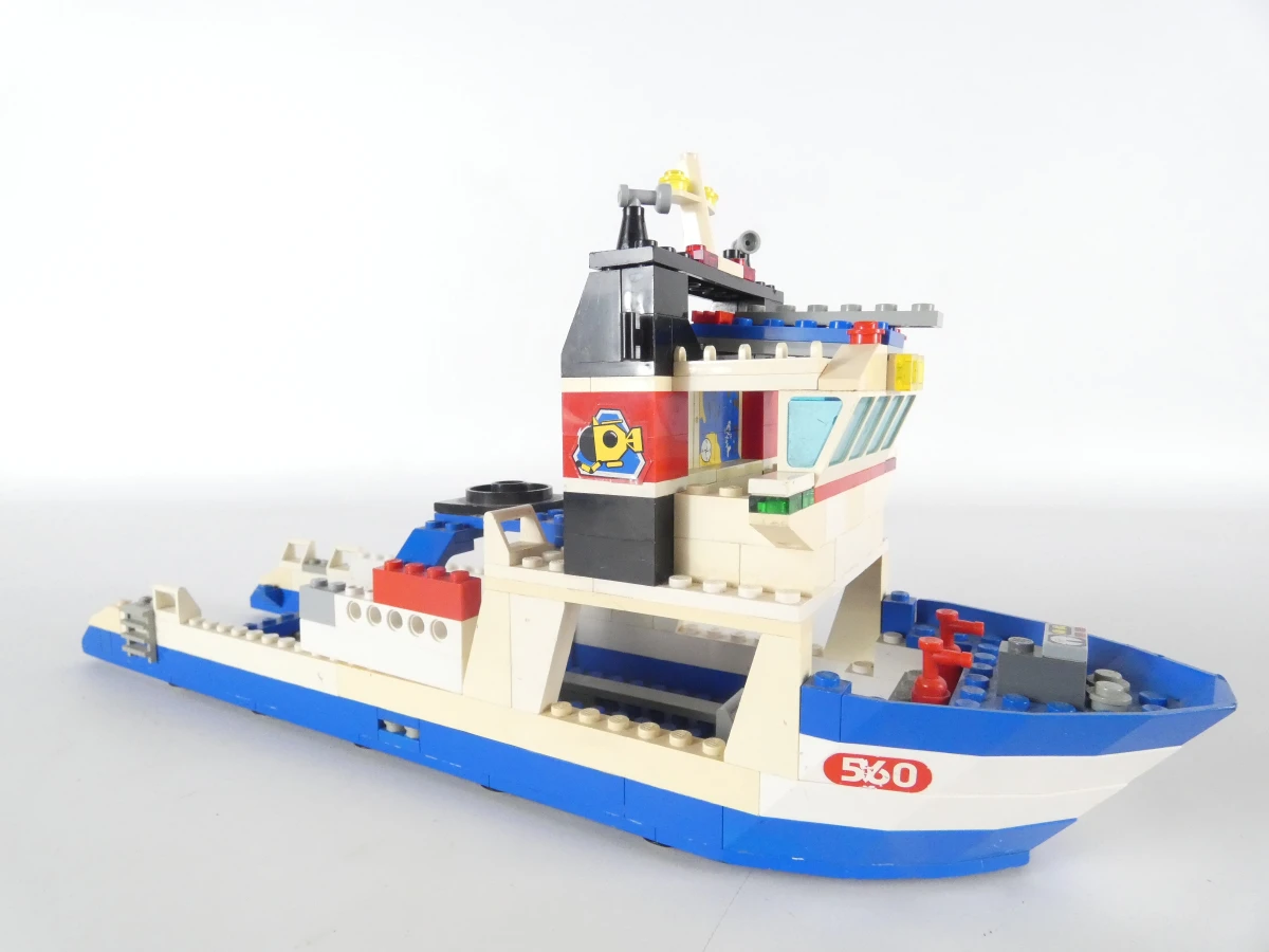 Diverse LEGO bouwsets met voertuigen en handleidingen