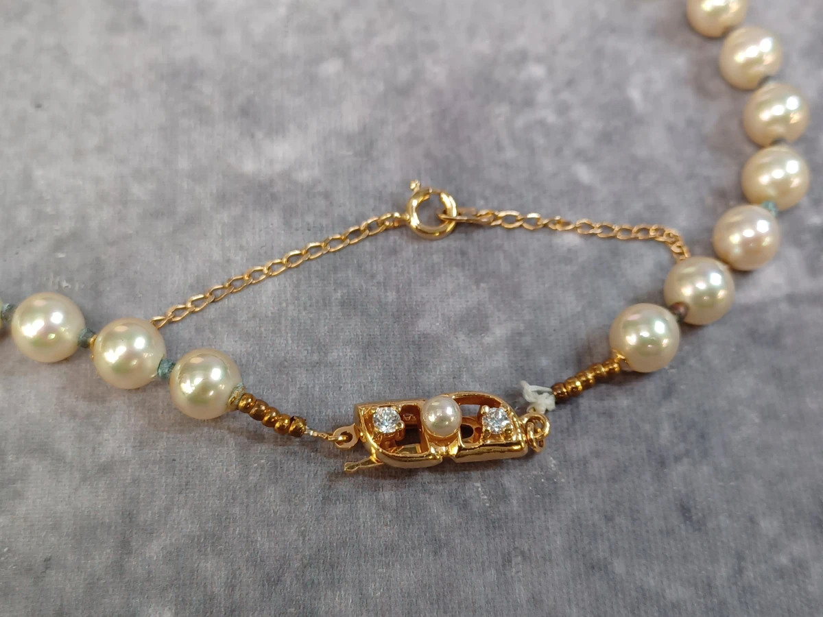 Vintage parelketting met bijbehorende broche - foto 3