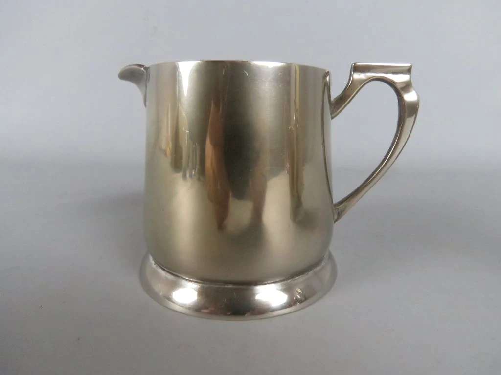 Set zilverkleurig koffie- en theeservies met kan, pot en melkkan - foto 11
