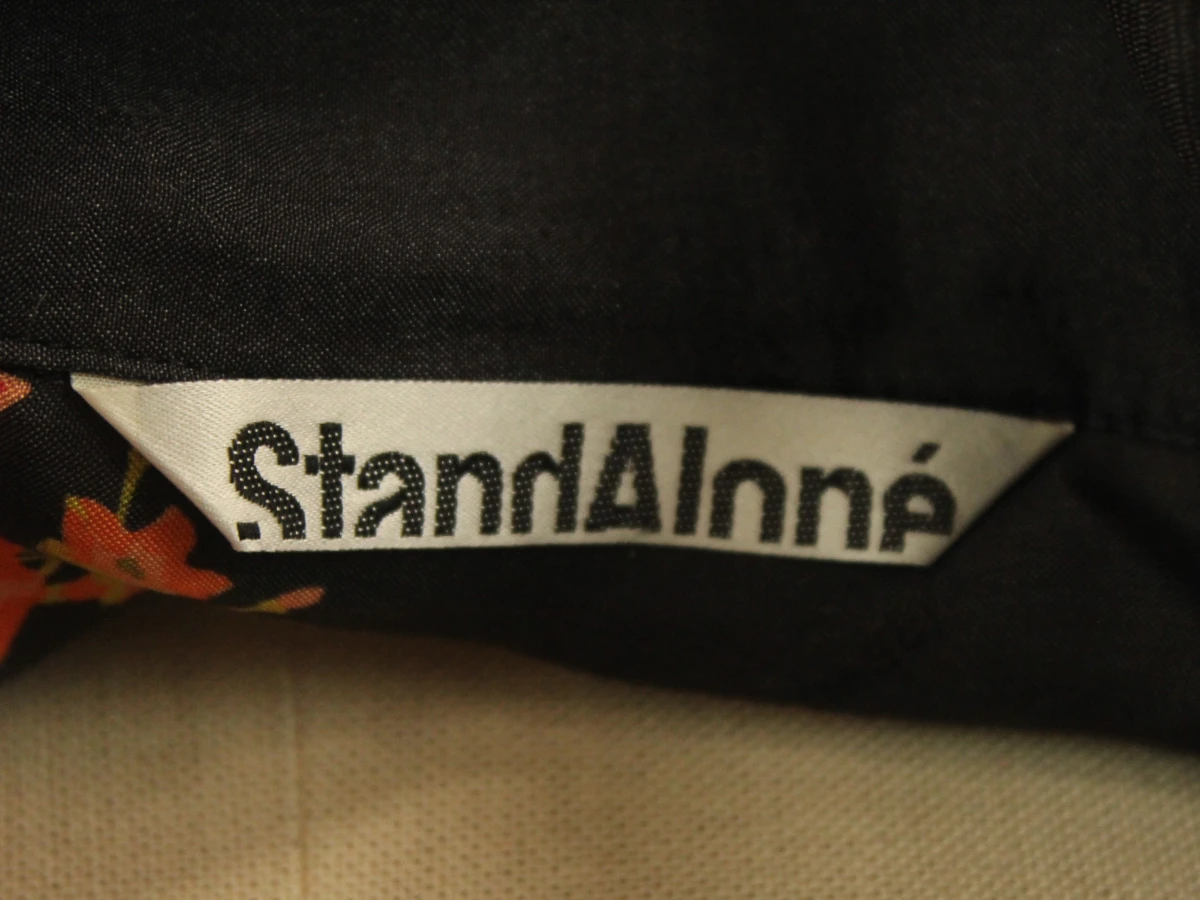 StandAloné zwarte blouse met oranje bloemenprint - foto 7