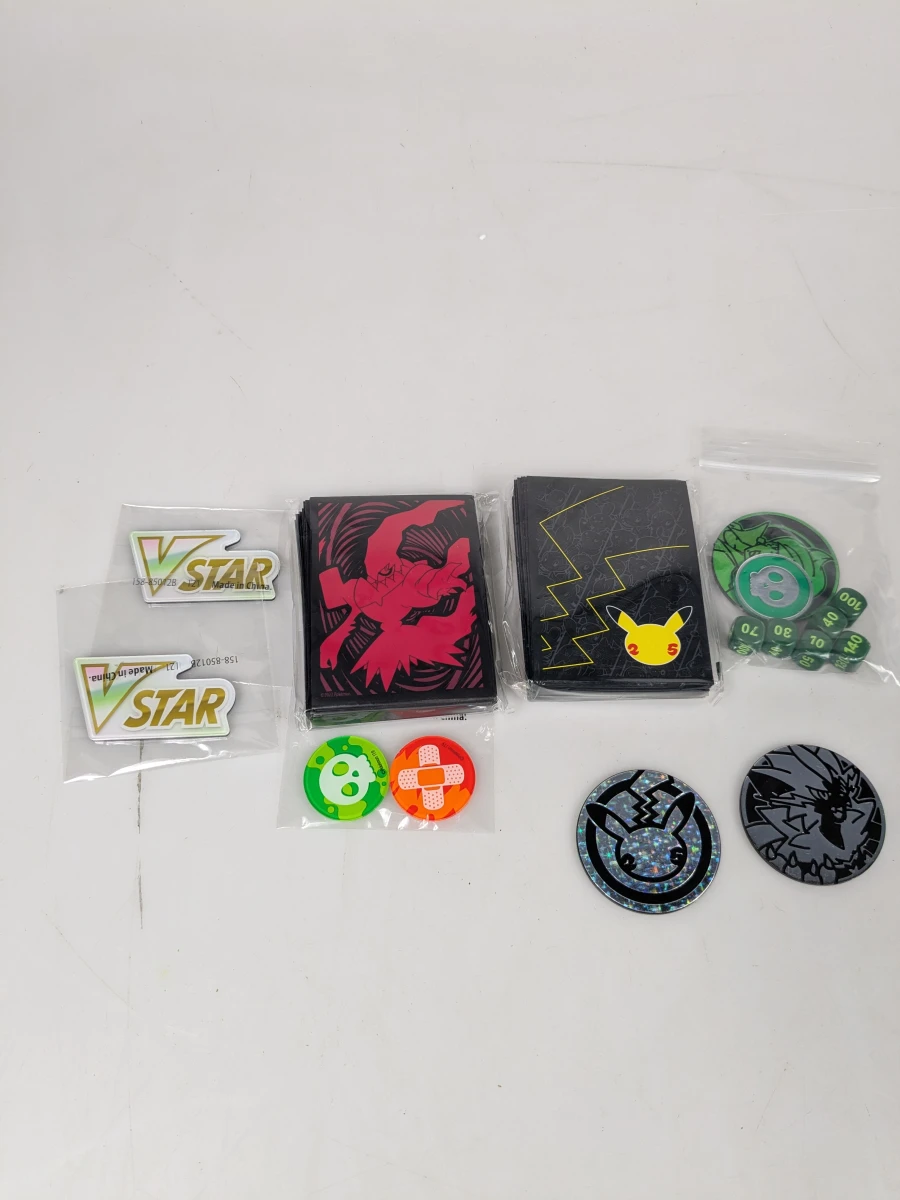Pokémon tin met kaarten en verzamelaccessoires met binder - foto 2