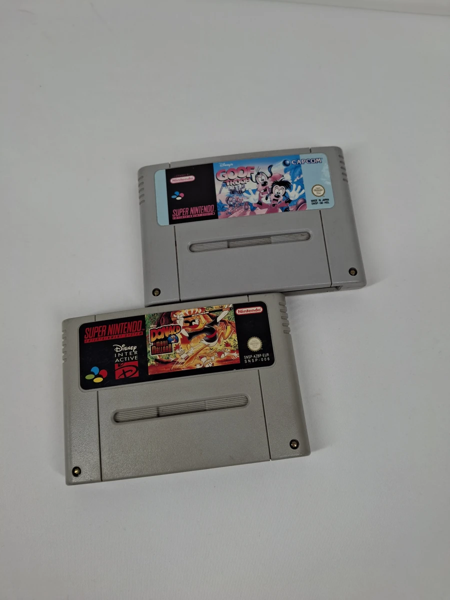 2 Super Nintendo spelcartridges Goof Troop en Donald in Maui Mallard – kavel bij De Kringwinkel, Geraardsbergen
