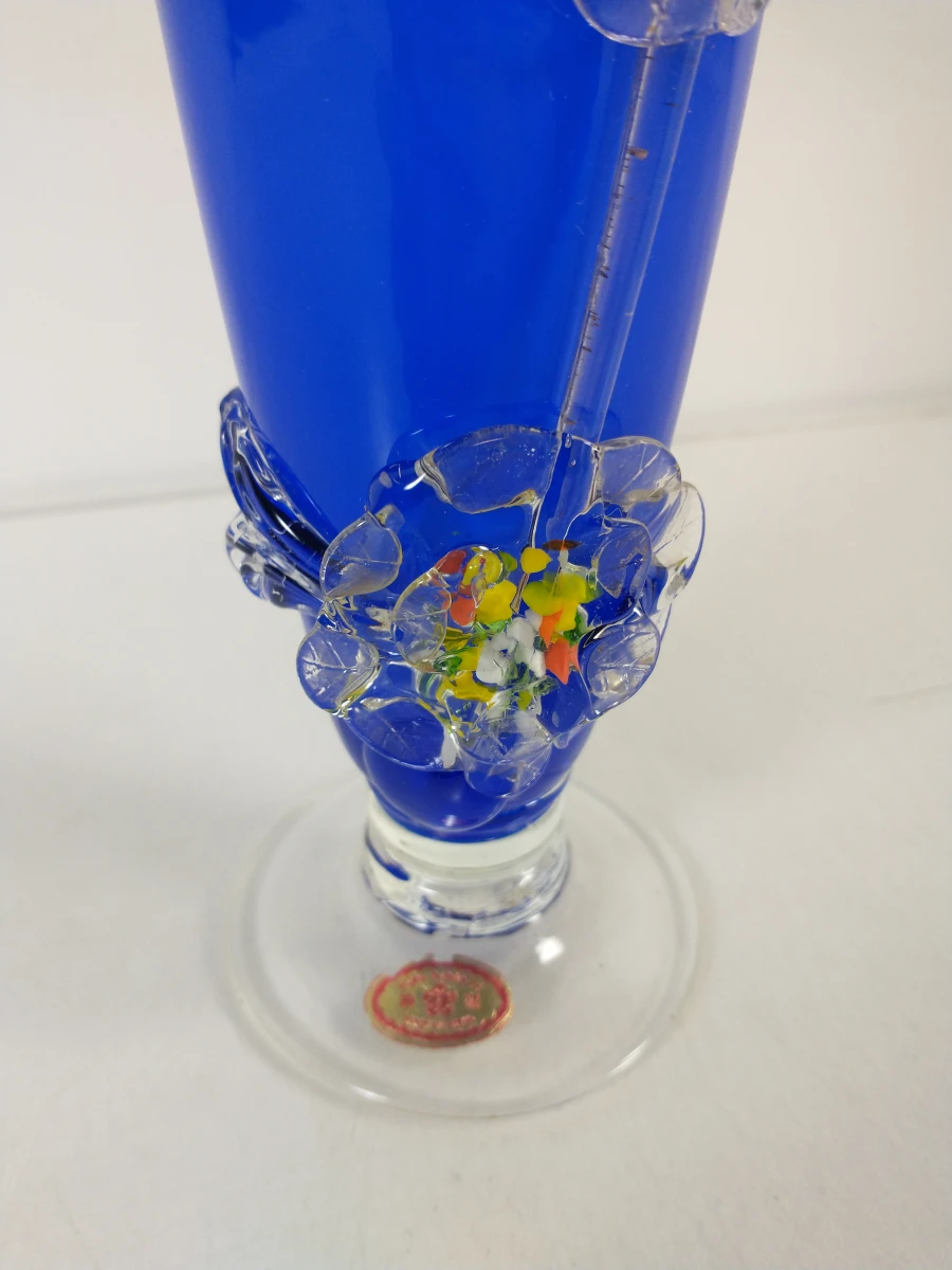 Blauwe glazen vaas met bloemdecoratie - foto 6