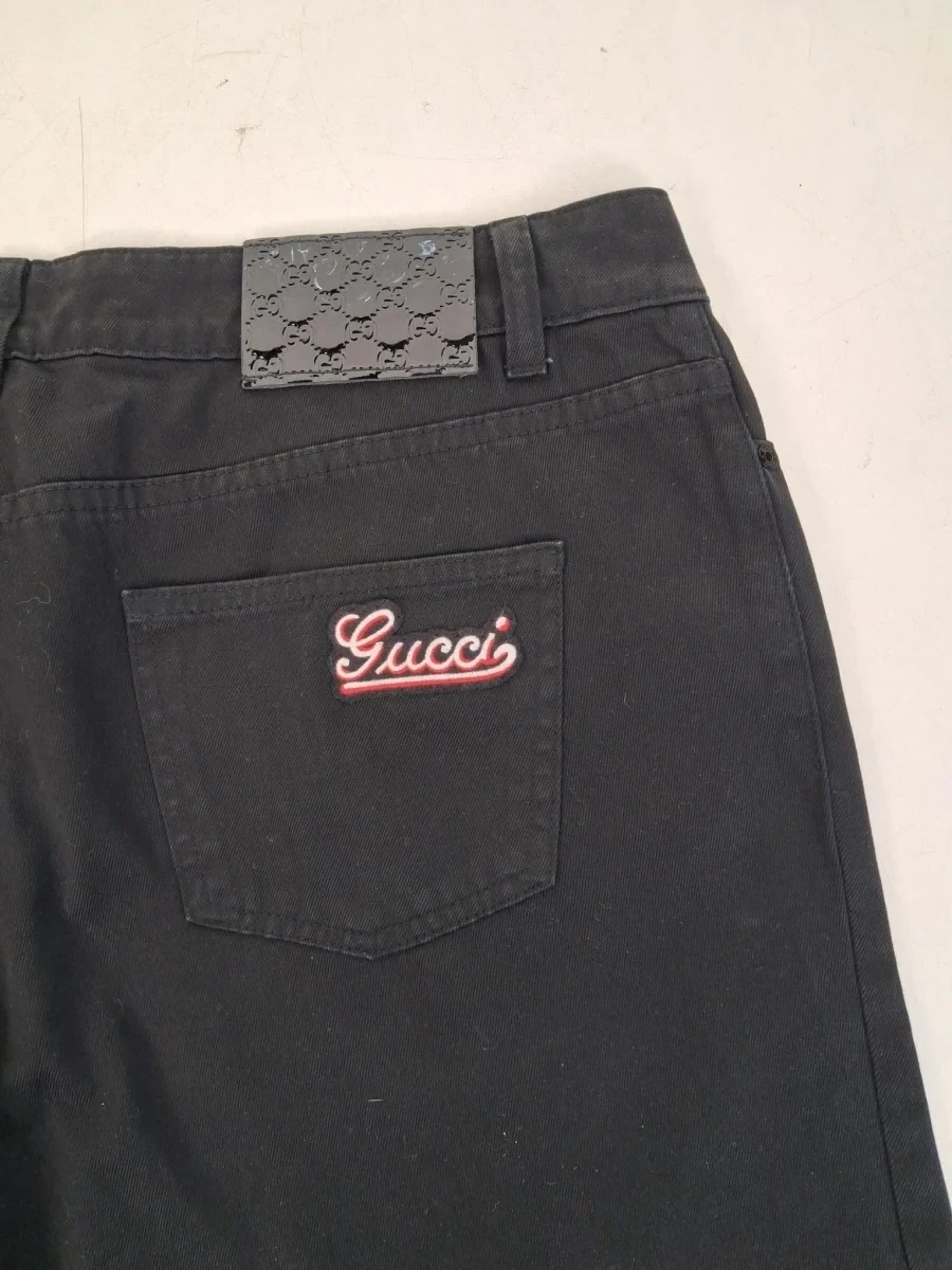 Zwarte denim jeans van het luxe modehuis Gucci - foto 3