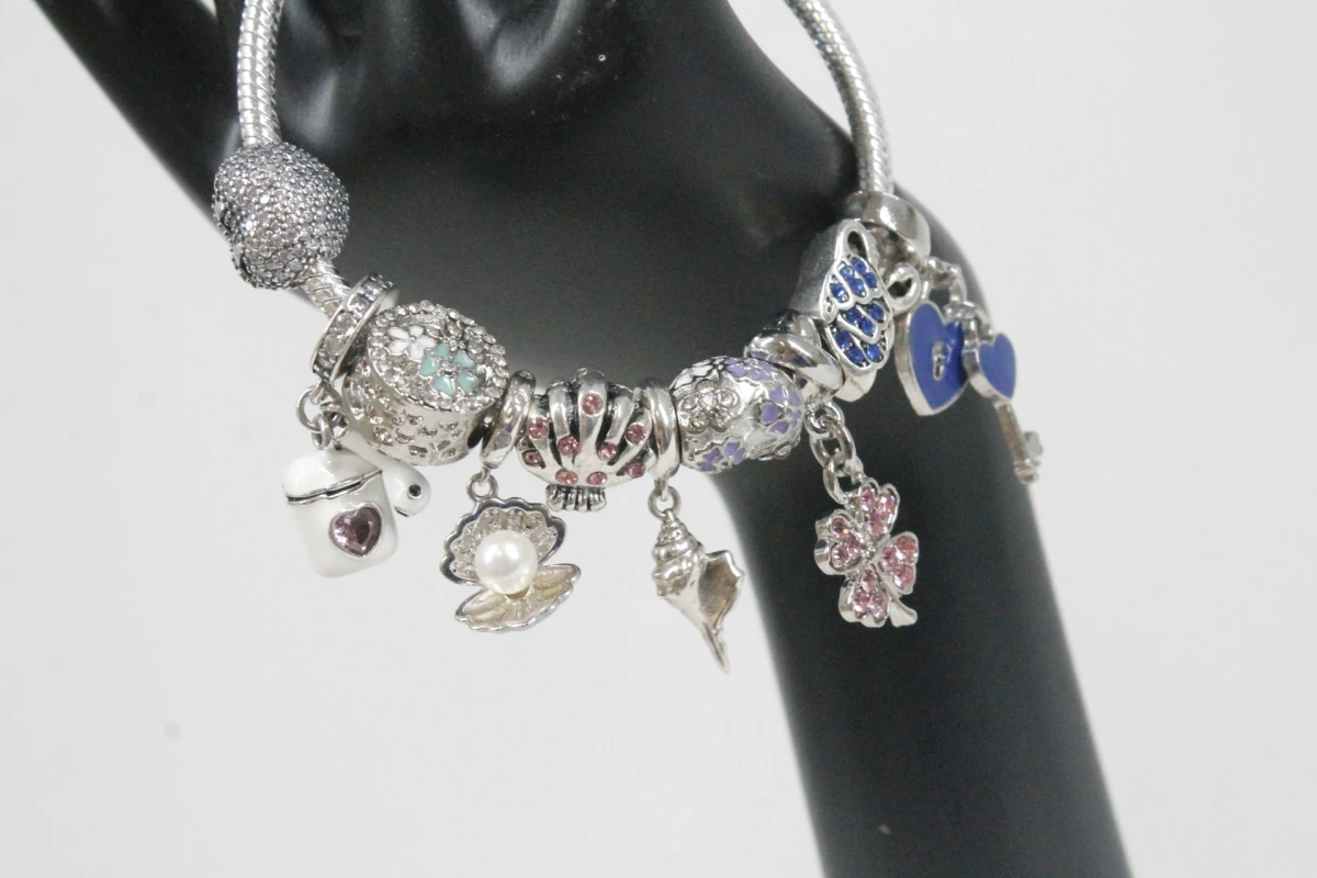 Pandora armband met diverse bedels - foto 4