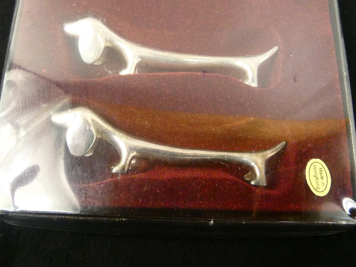 Set vintage 12 zilverkleurige hondenbestekhouders