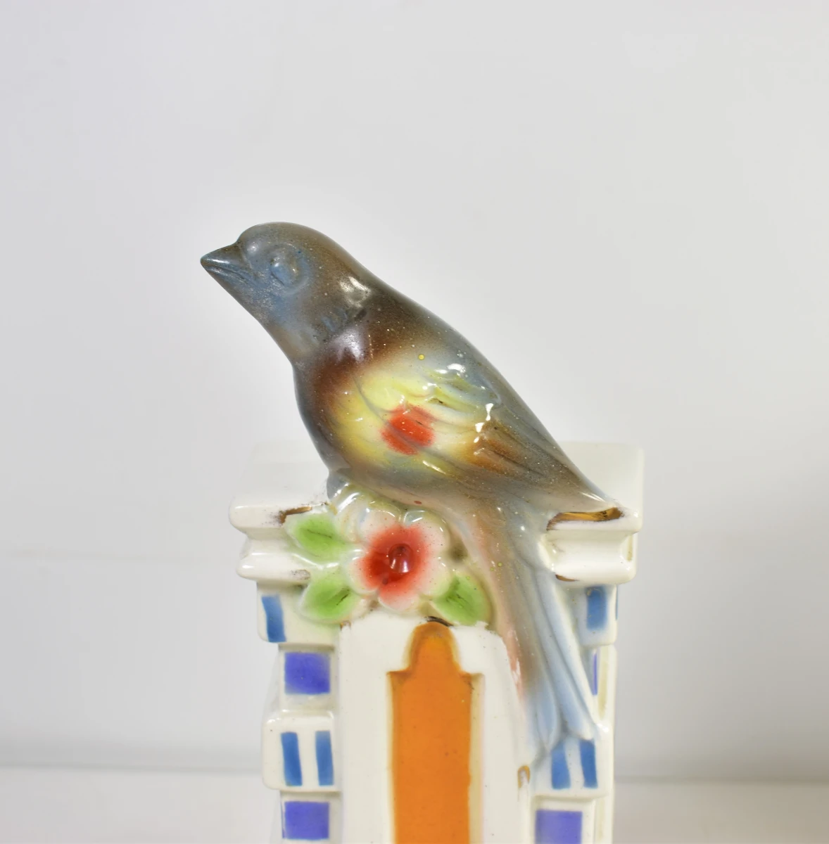 Vintage porseleinen klok met vogeldecoratie
