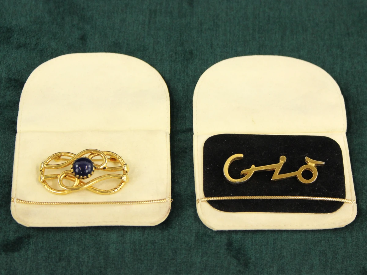 2 vintage Giorgio Armani broches