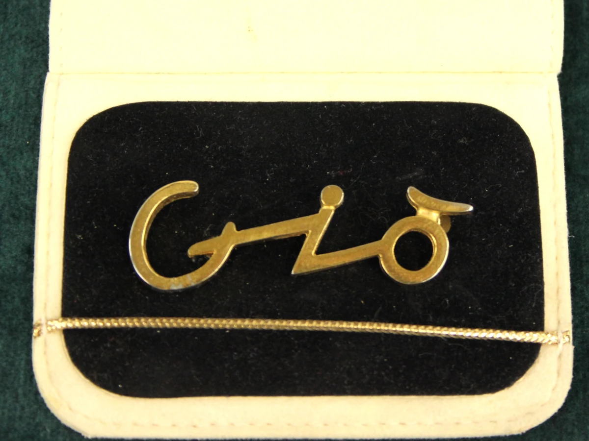 2 vintage Giorgio Armani broches