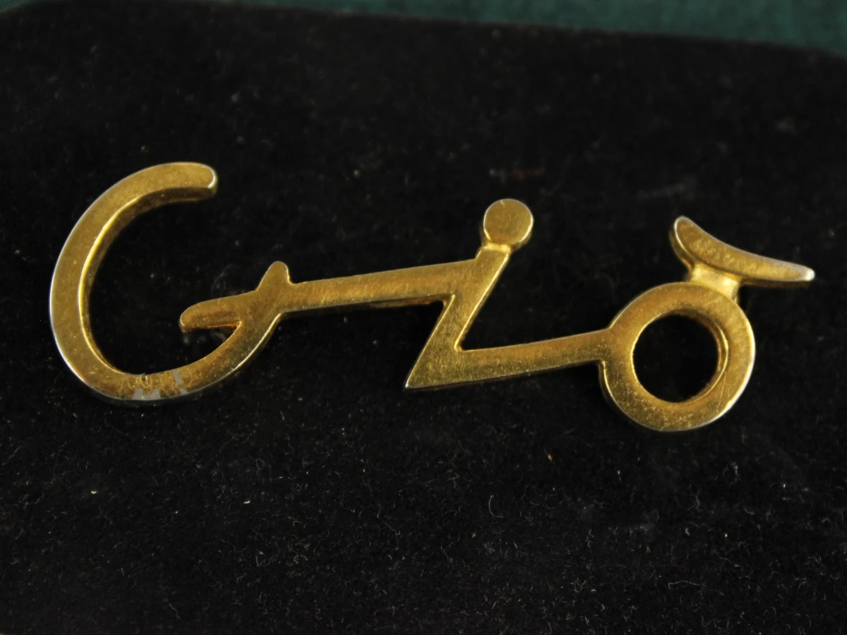 2 vintage Giorgio Armani broches