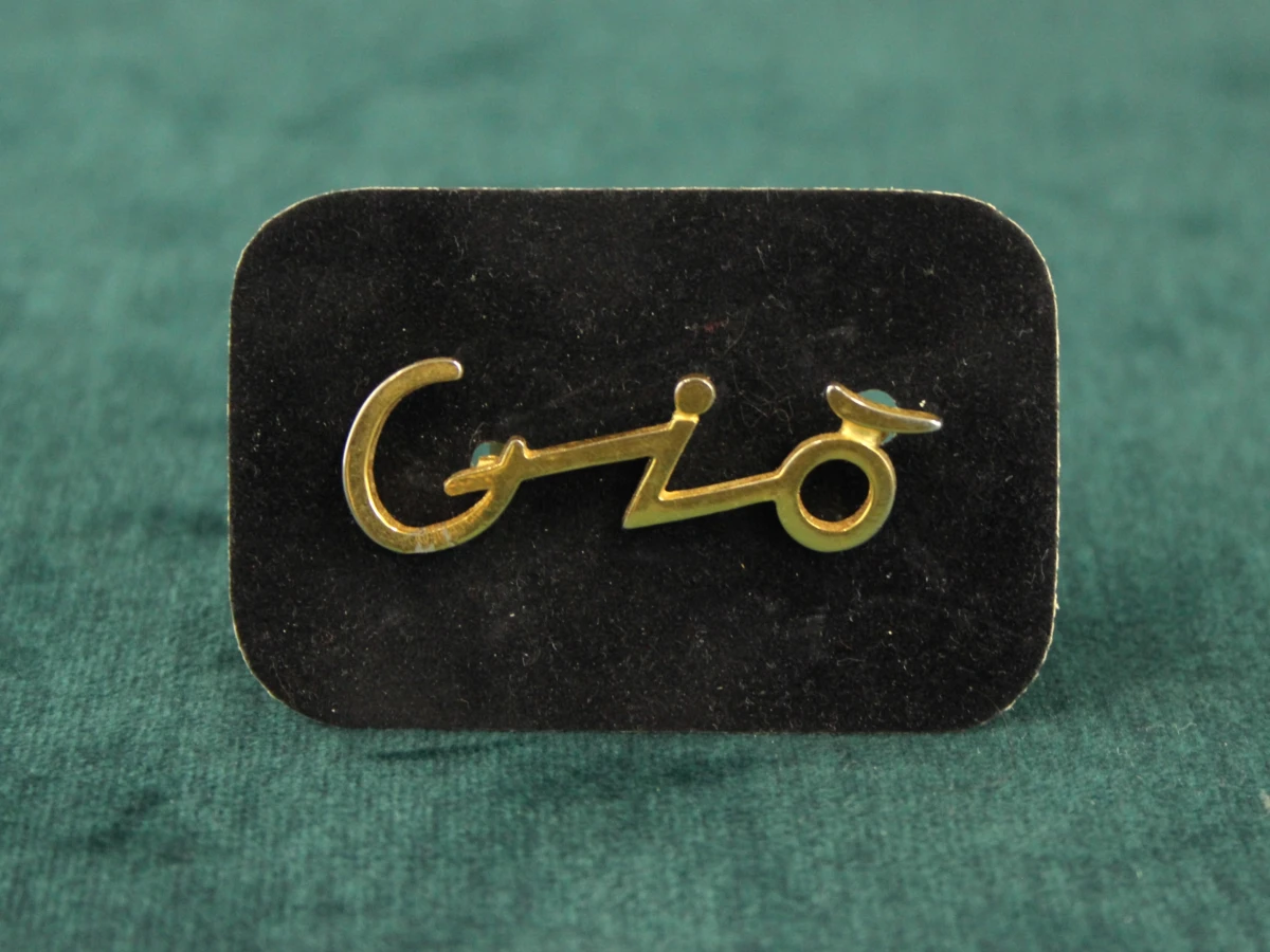 2 vintage Giorgio Armani broches