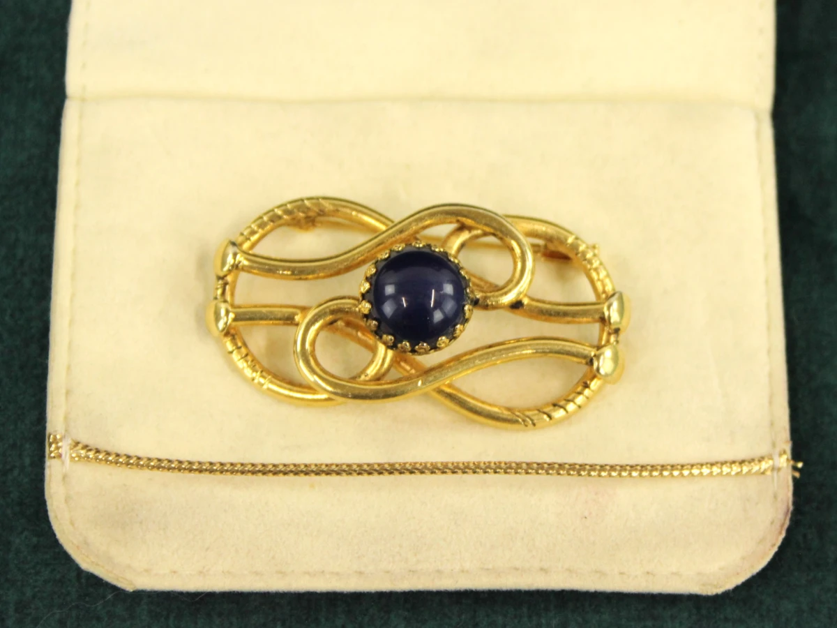 2 vintage Giorgio Armani broches