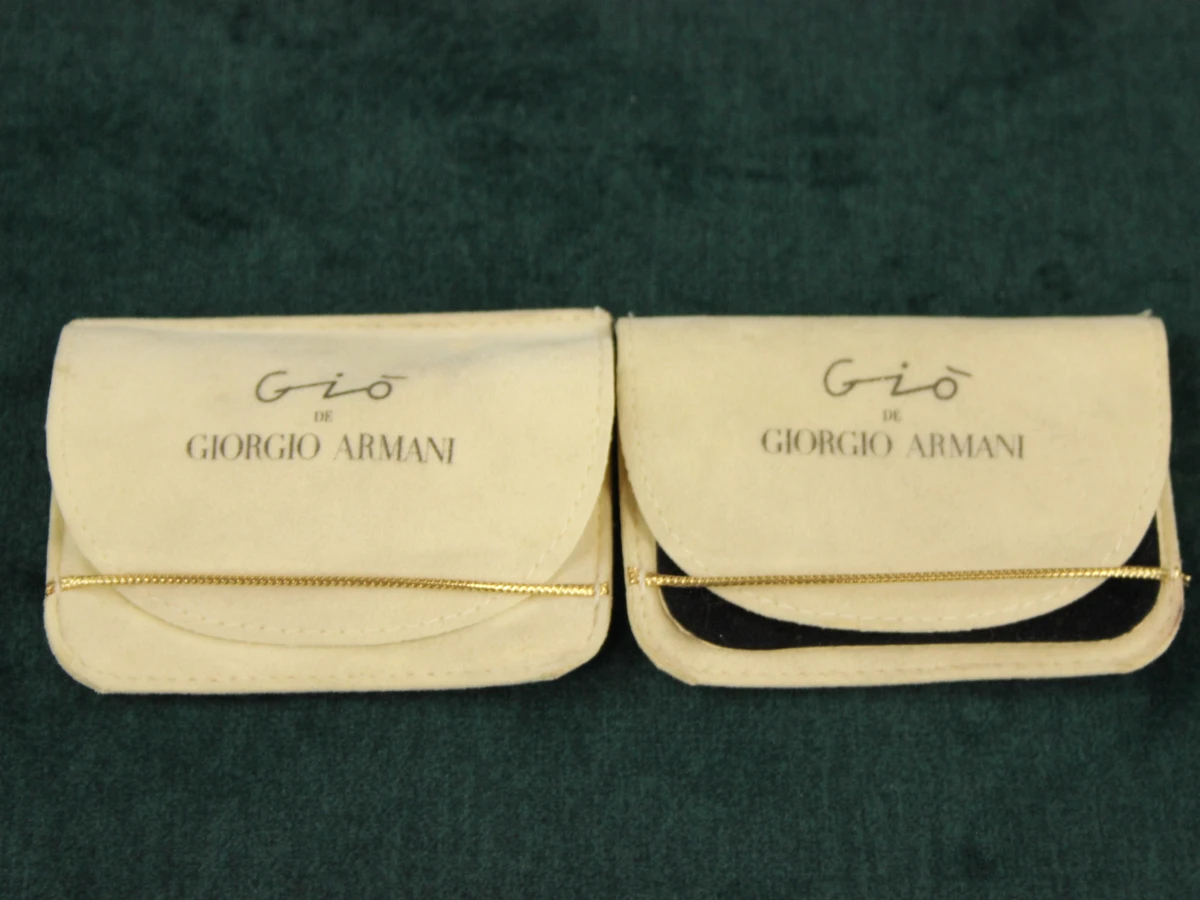2 vintage Giorgio Armani broches