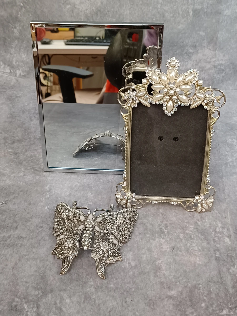 Elegante Swarovski fotolijst met bijpassende spiegel en vlinder haarspeld