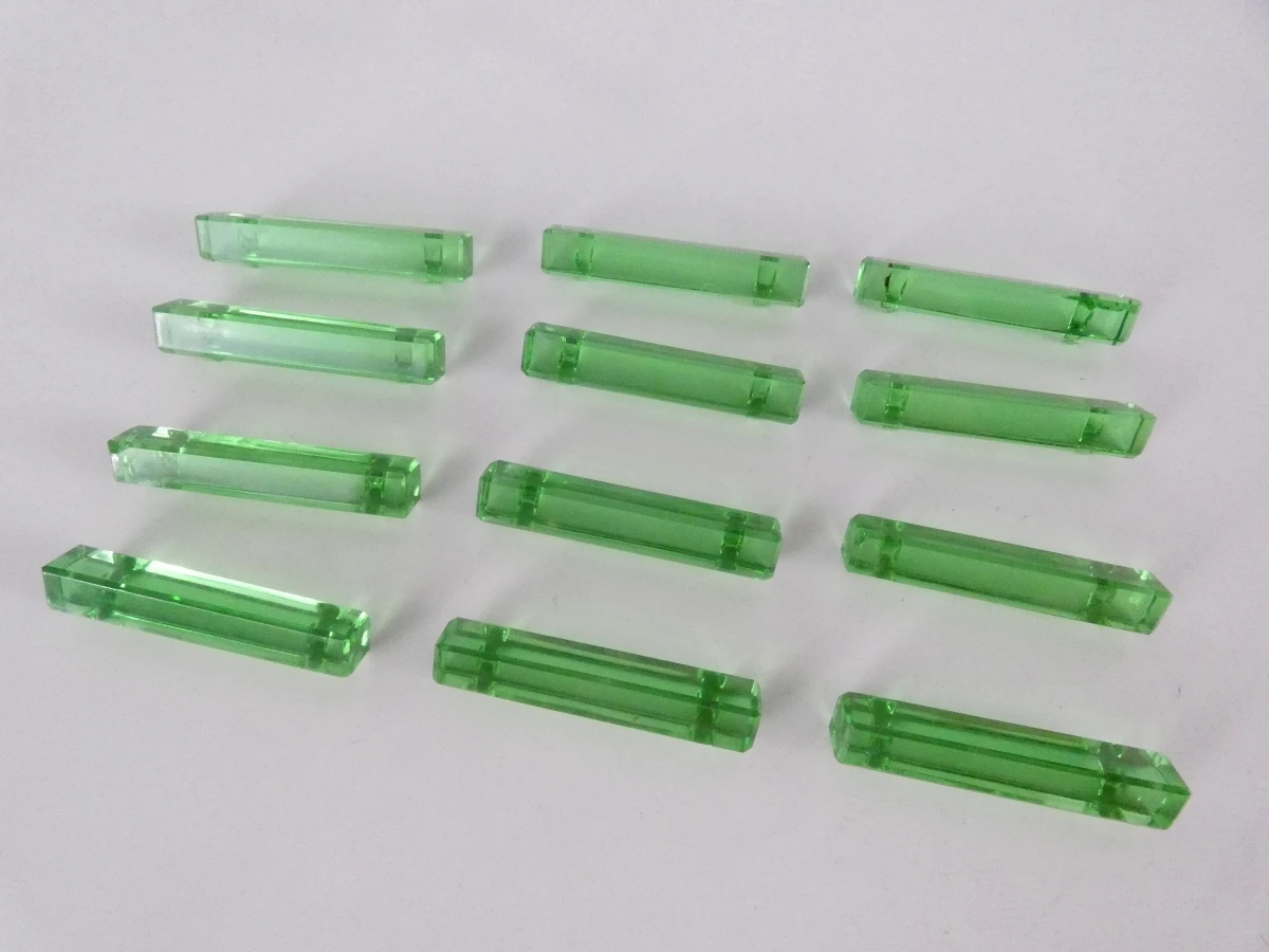 Set van 12 groene glazen messenleggers