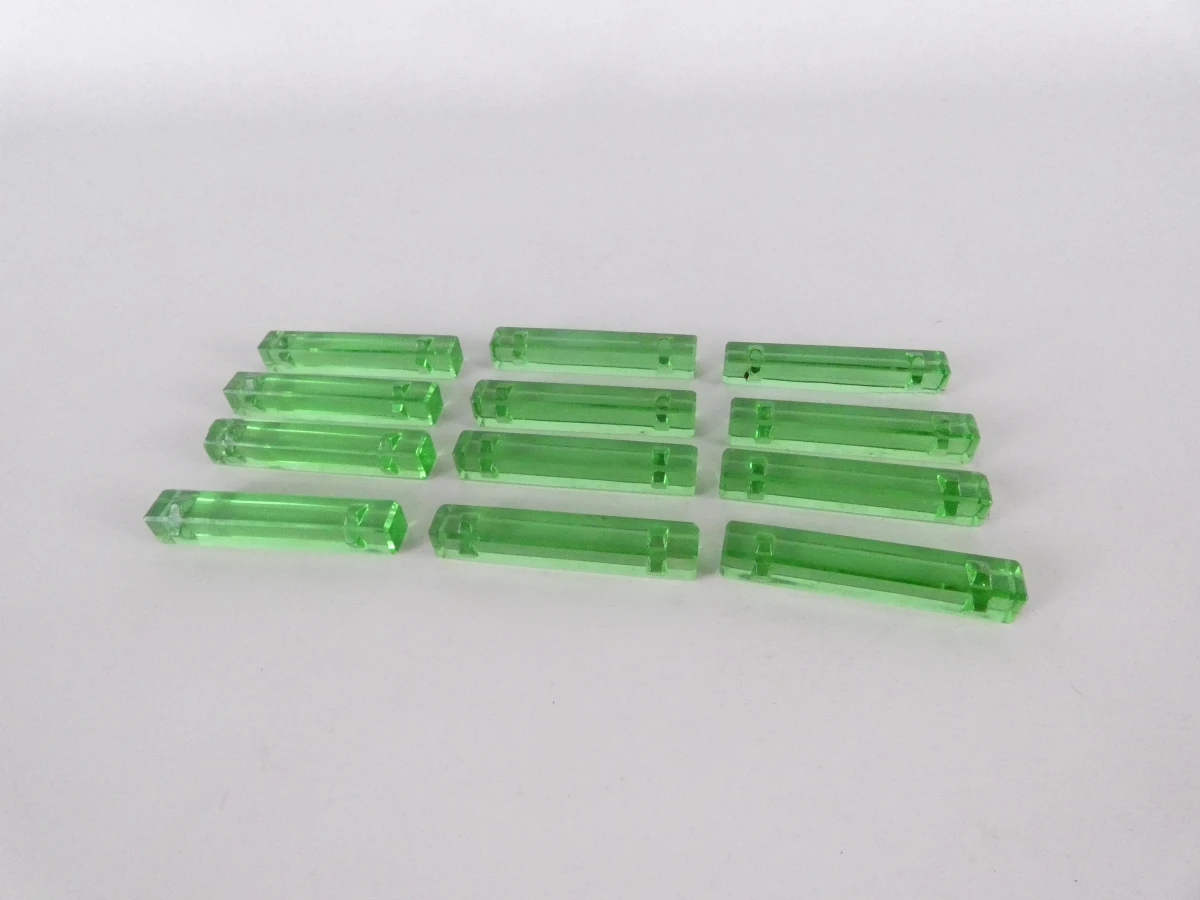 Set van 12 groene glazen messenleggers