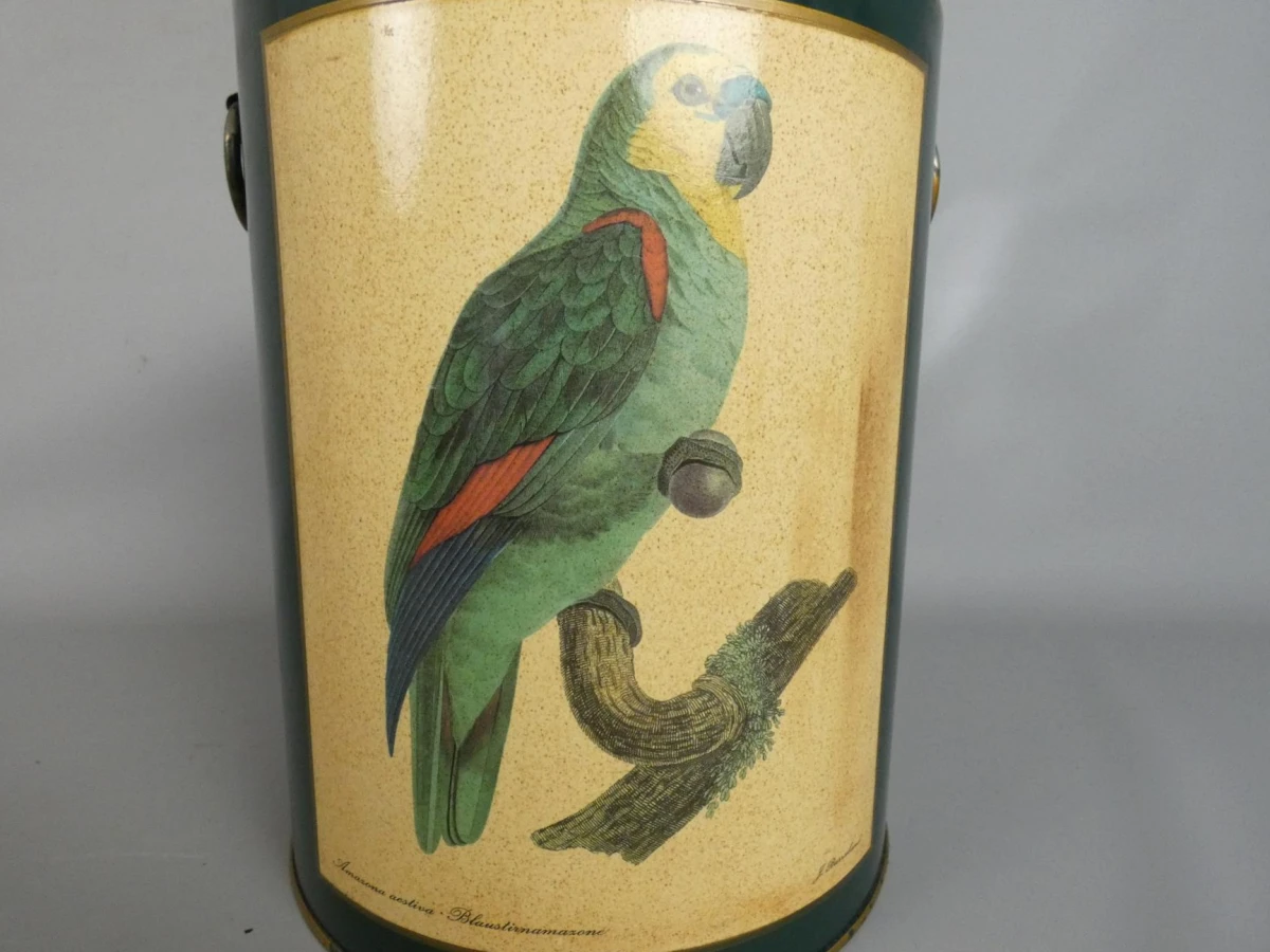 Vintage metalen prullenbak met papegaai-illustratie