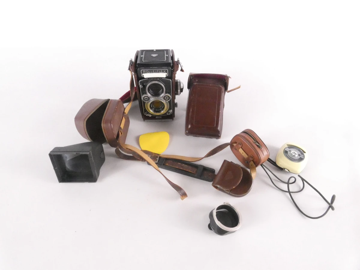 Vintage Rolleiflex camera met accessoires en leren hoes