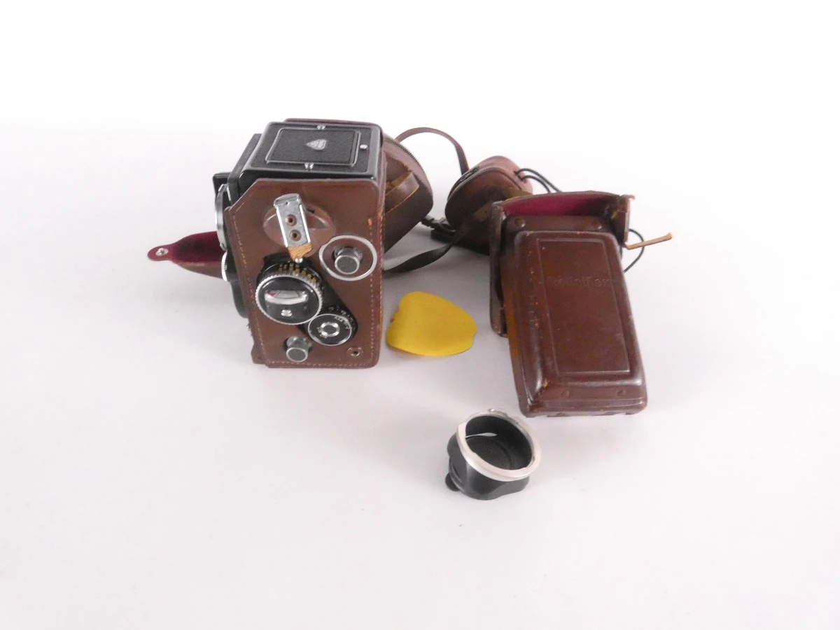 Vintage Rolleiflex camera met accessoires en leren hoes