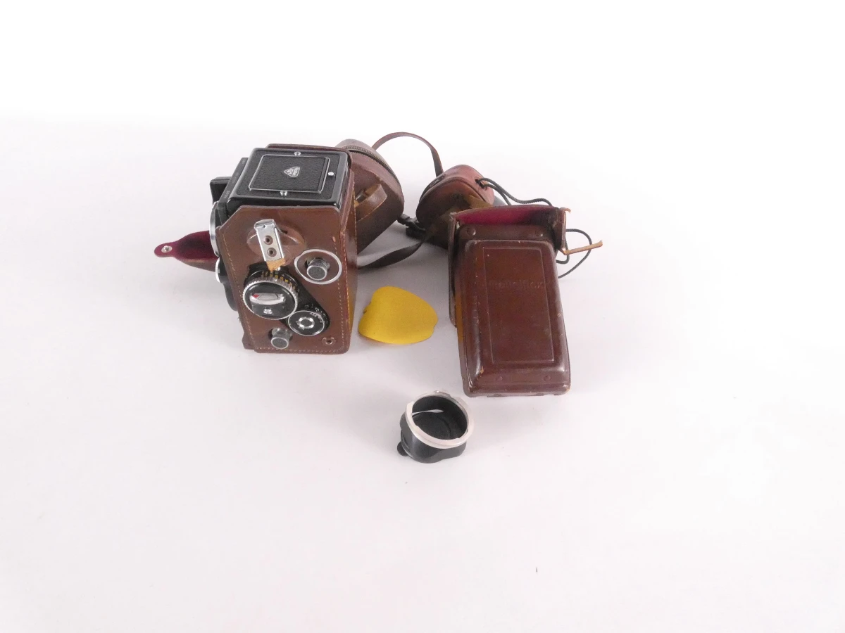 Vintage Rolleiflex camera met accessoires en leren hoes
