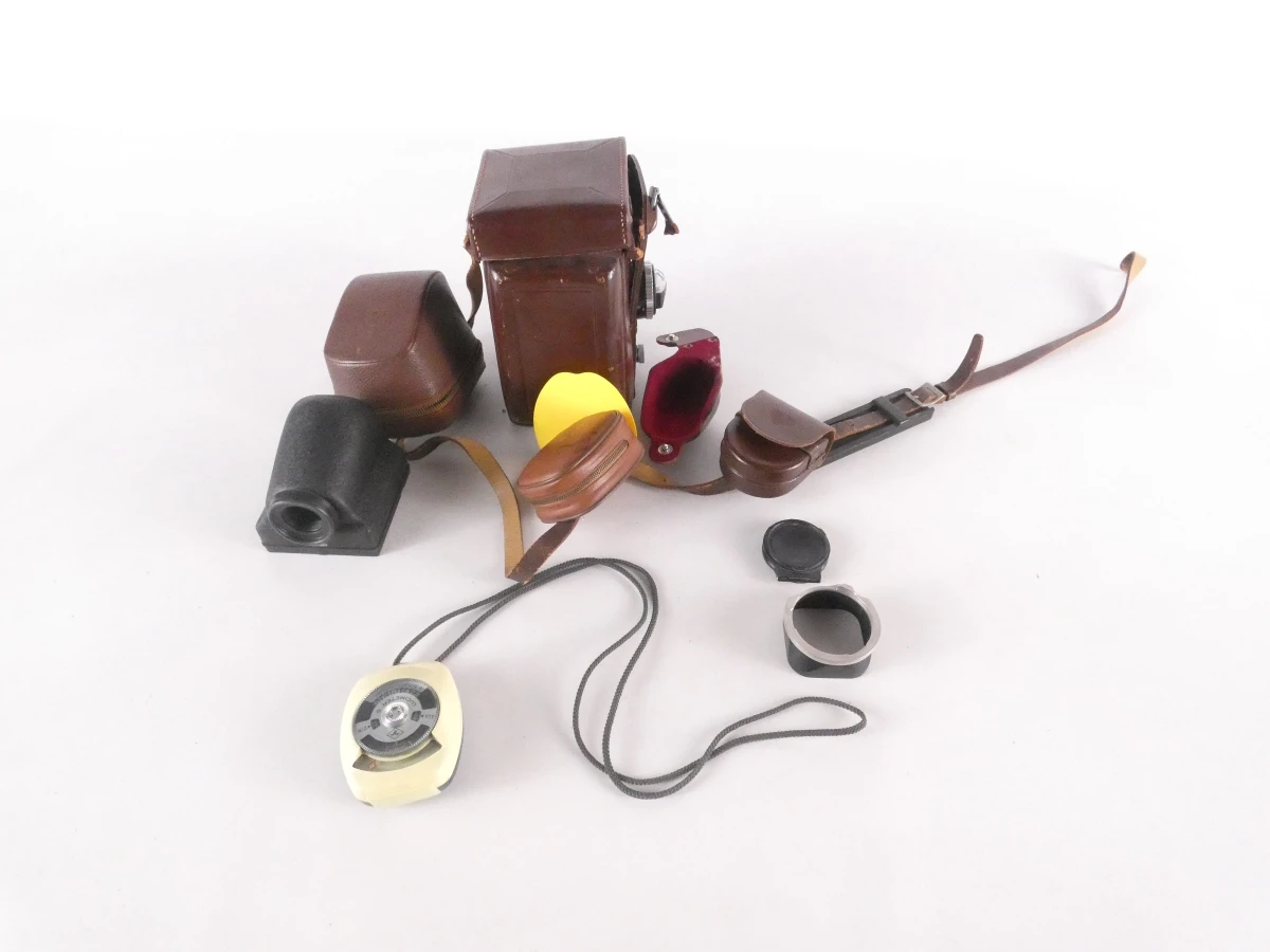 Vintage Rolleiflex camera met accessoires en leren hoes