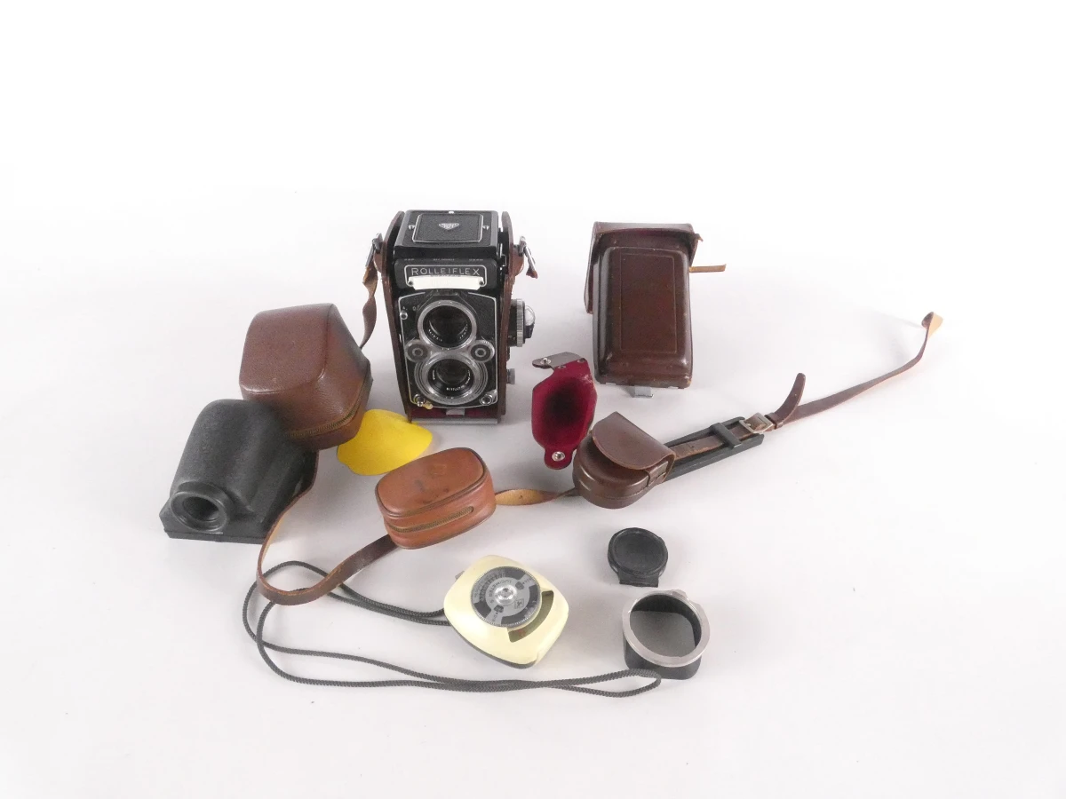 Vintage Rolleiflex camera met accessoires en leren hoes