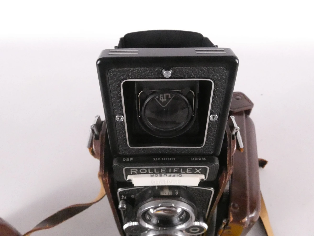 Vintage Rolleiflex camera met accessoires en leren hoes