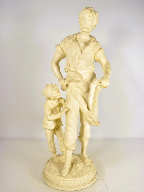 Beeld van man en kind in beige kleur
